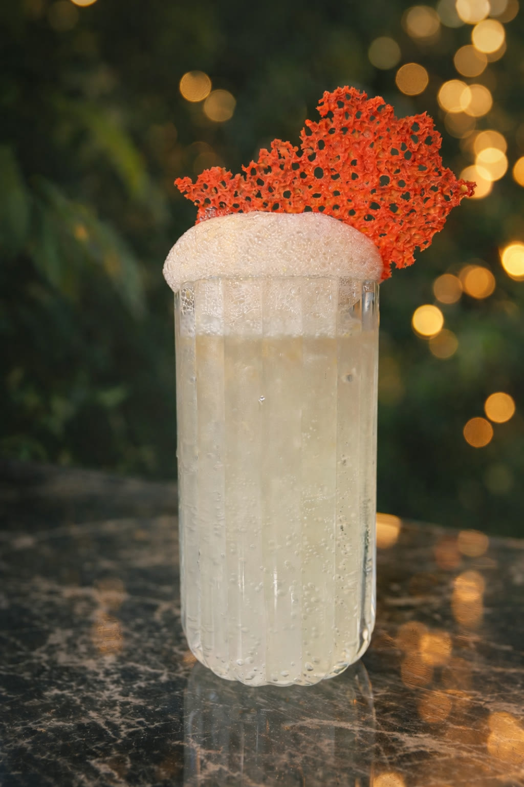 Paloma Ajena — highball with coral garnish