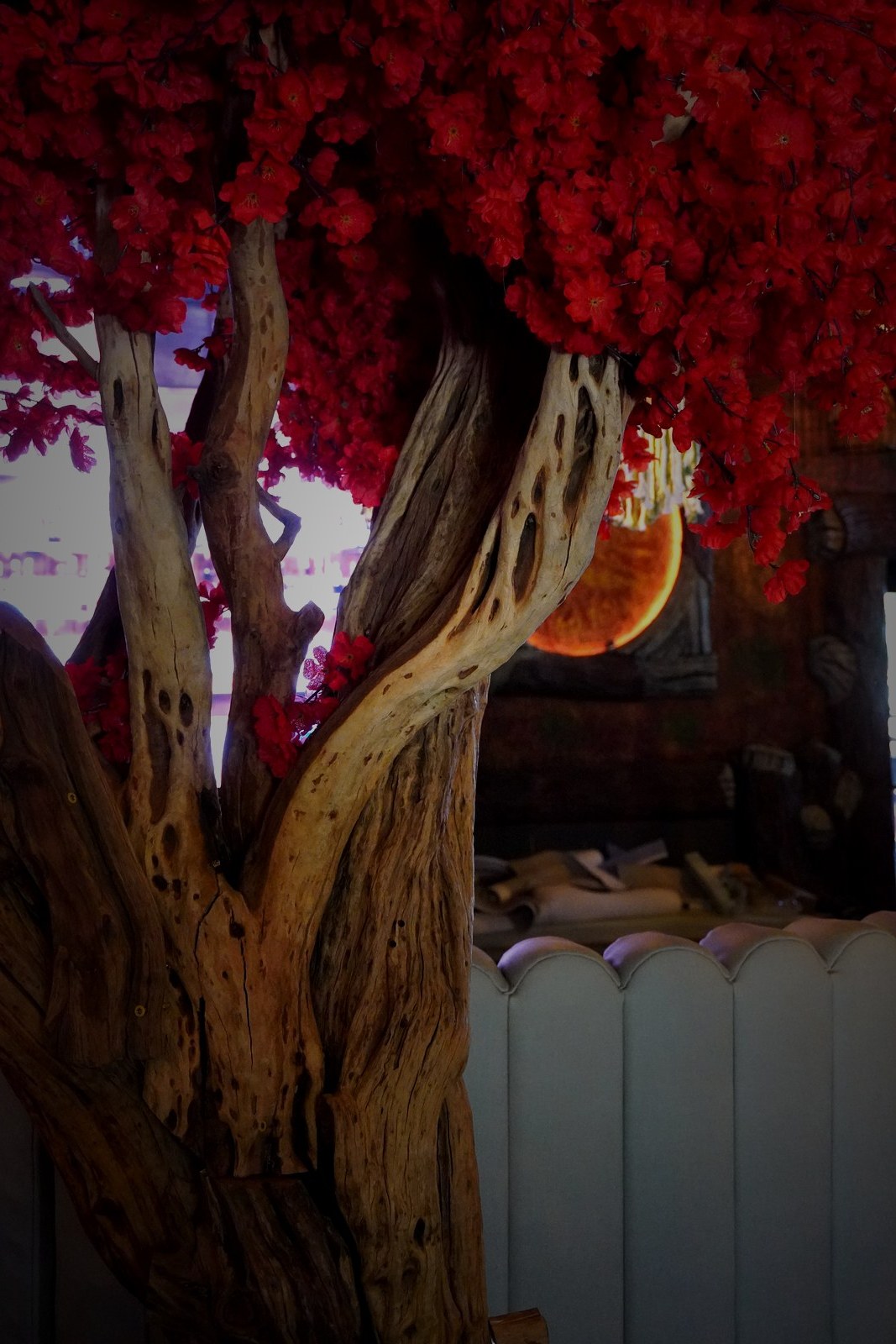 Red flowering sculptural tree — interior installation