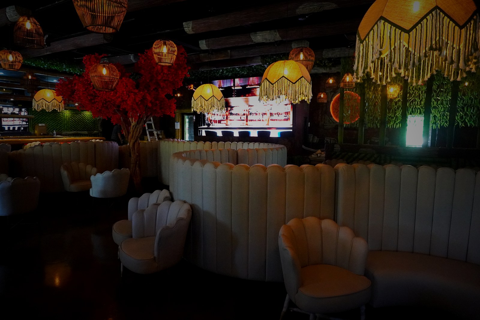 Casa Tequila Prime lounge — scalloped booth seating and warm lighting
